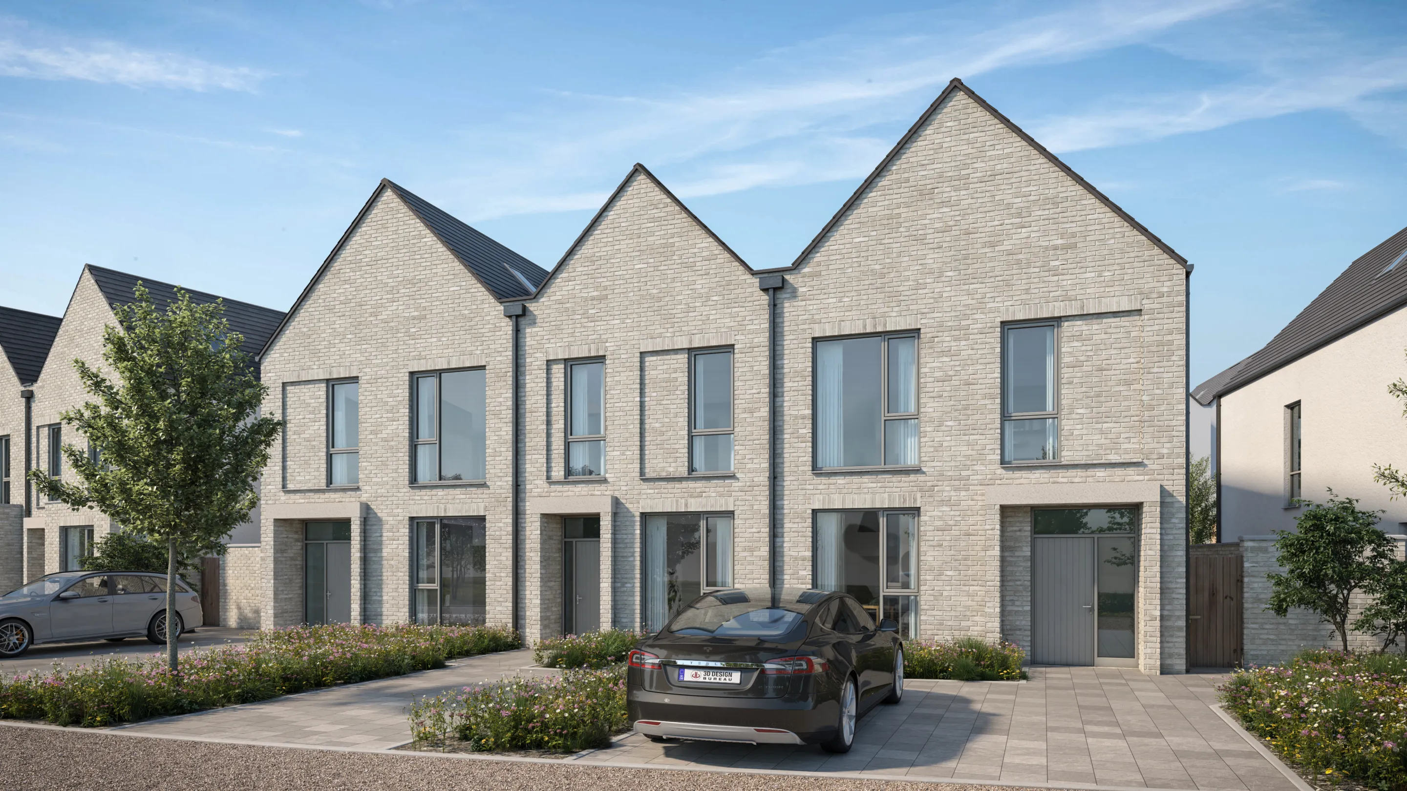 A row of modern terraced houses with landscaping and cars in the driveway