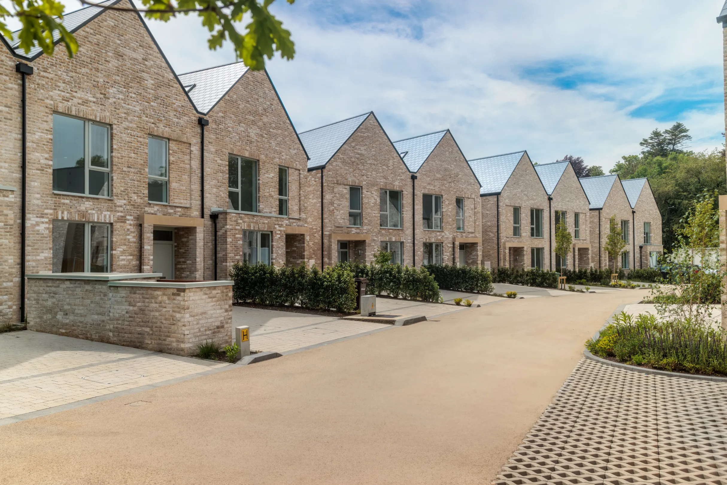 A row of modern terraced houses with landscaping