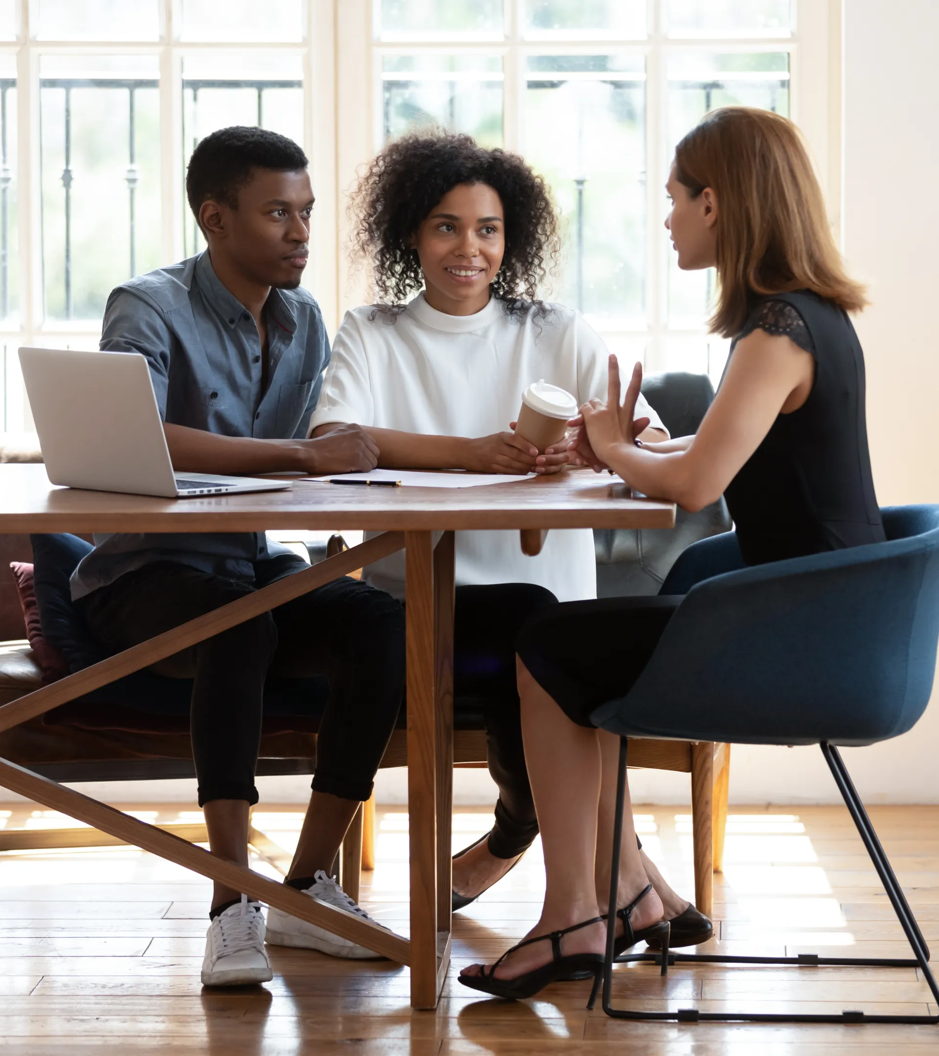 A young couple getting advice on purchasing their new home