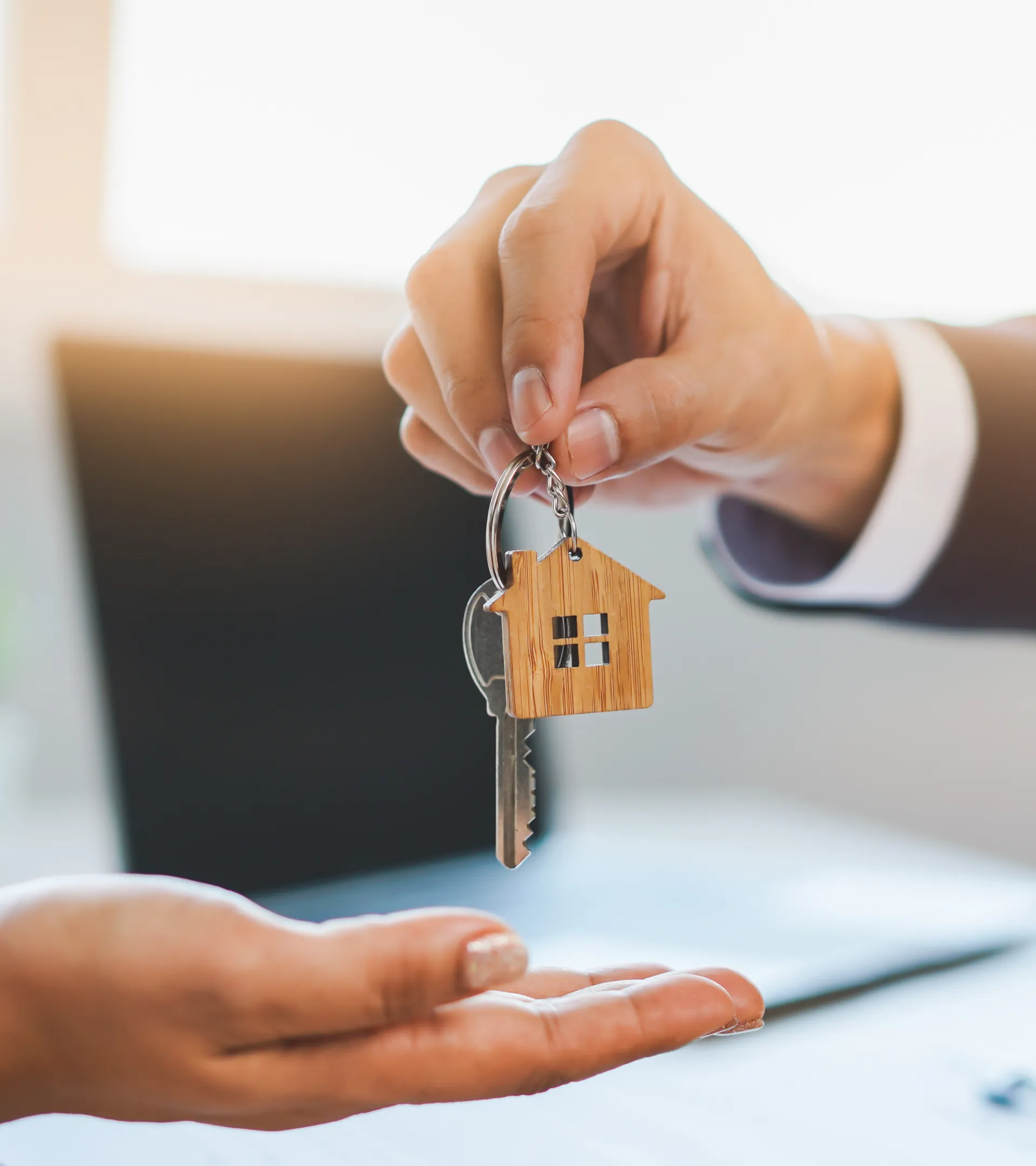 A person being handed the keys to their new property