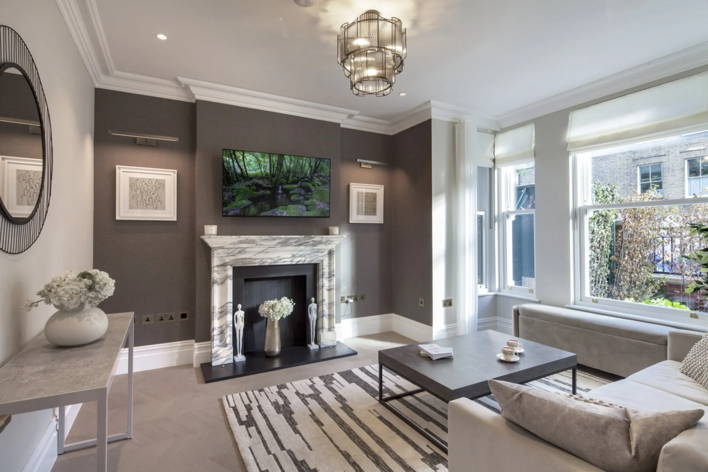 Reception room (fireplace): A refined reception room centred on a marble fireplace, with a period-style bay window.