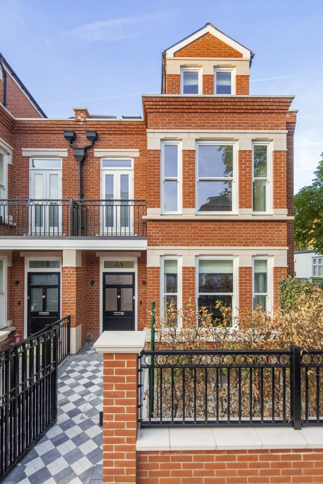 Front exterior (street view): Victorian-inspired architecture meets modern craftsmanship in this elegant end-of-terrace home behind traditional iron railings.