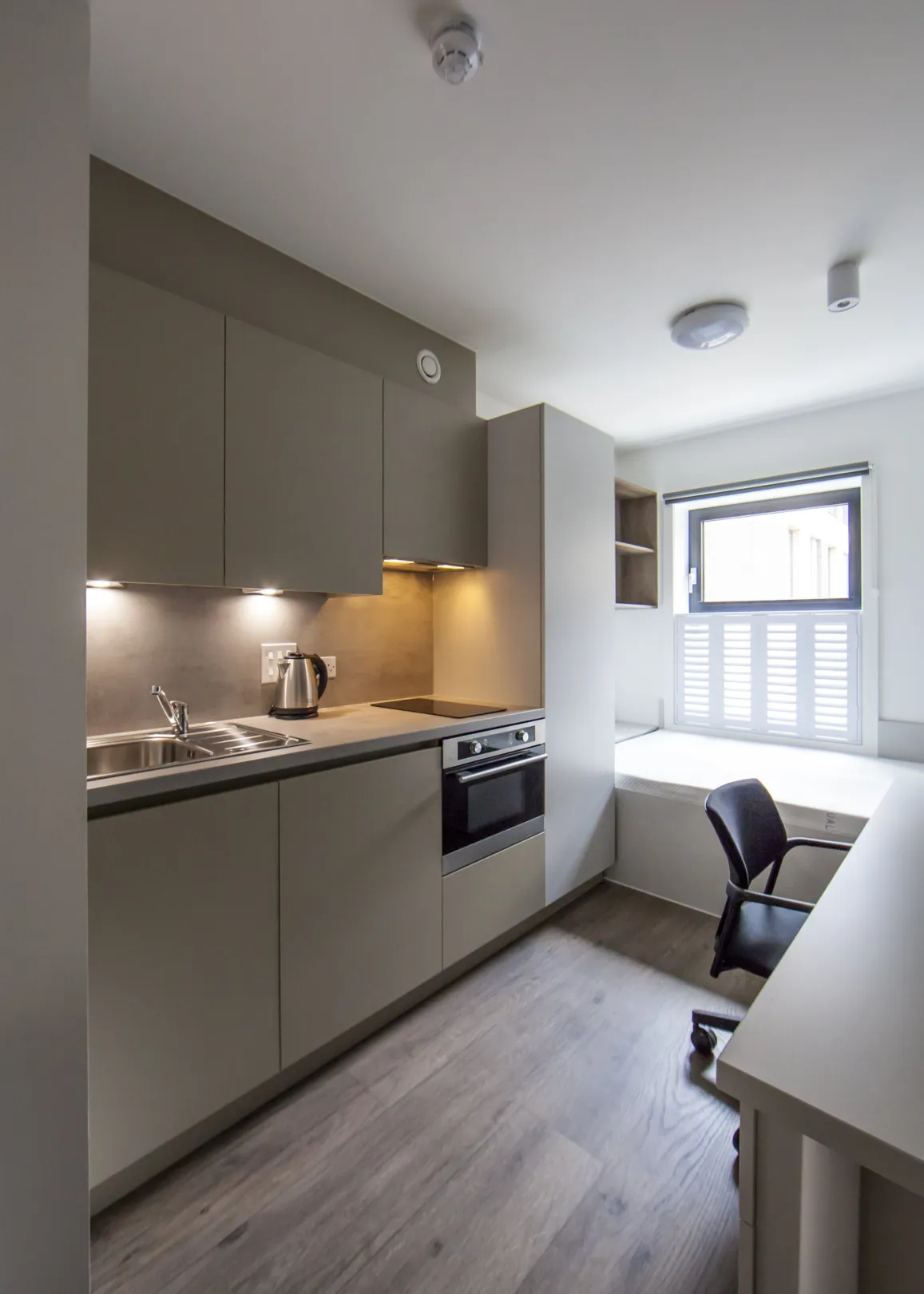 Kitchen, sleeping and study area in student accommodation