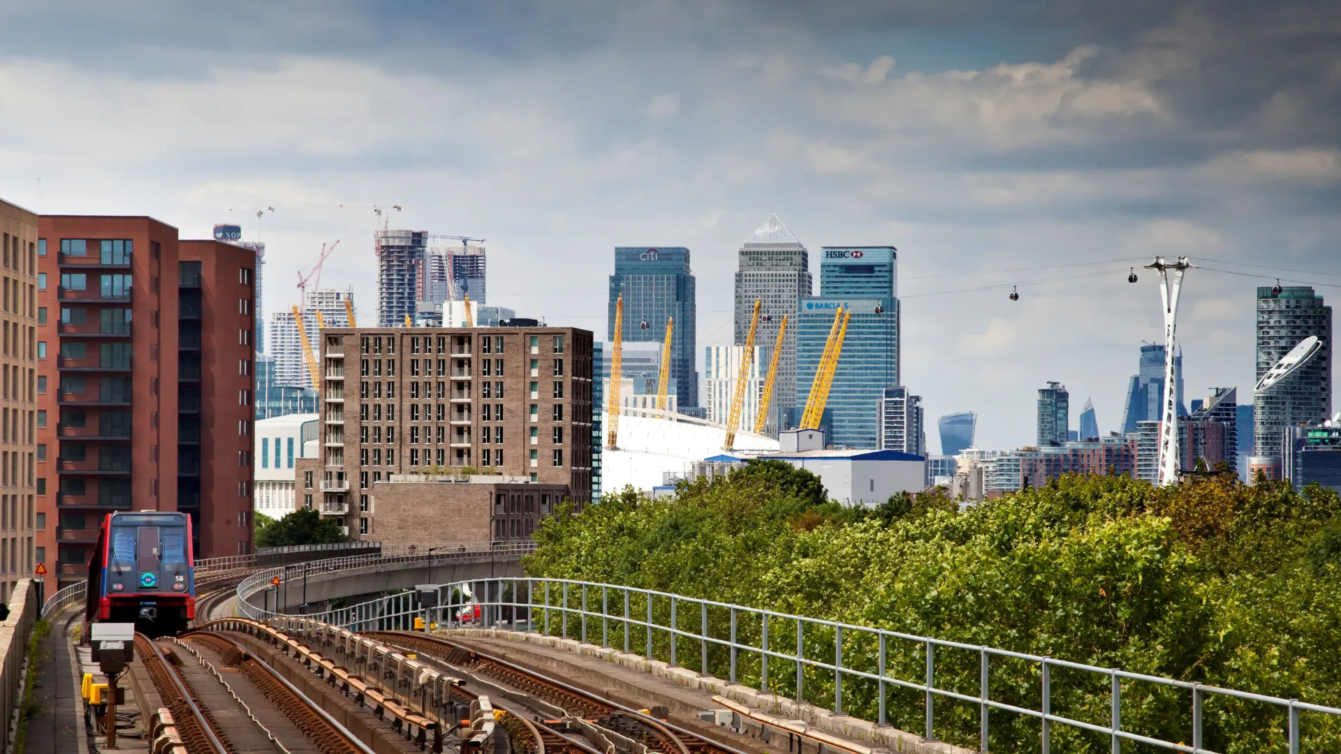 View of a new build development in the distance, with the O2 and Canary Wharf in the background