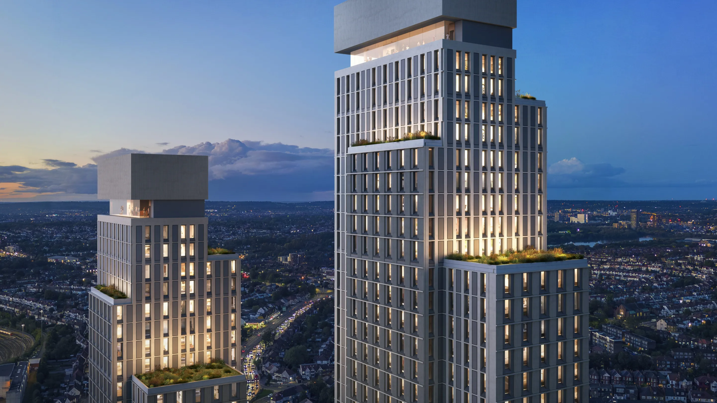 Two large residential towers seen from height, with a city landscape stretching into the distance below. Multiple communal rooftop gardens are shown at different levels on each tower and each has a glazed viewing area at penthouse level.