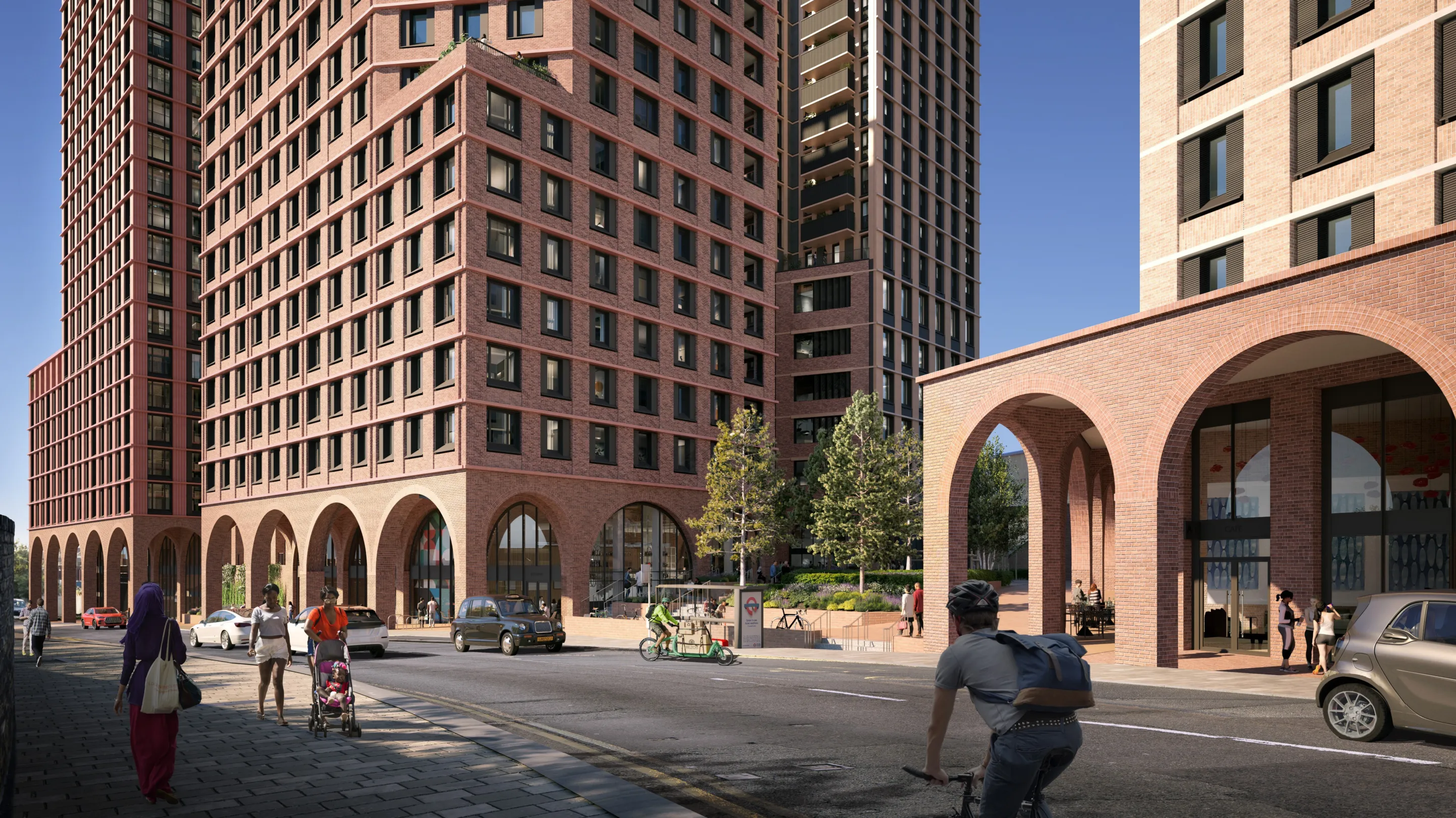 Large residential buildings rises above brick arches housing commercial space at ground level. Pedestrians, cyclists and cars are at ground level.