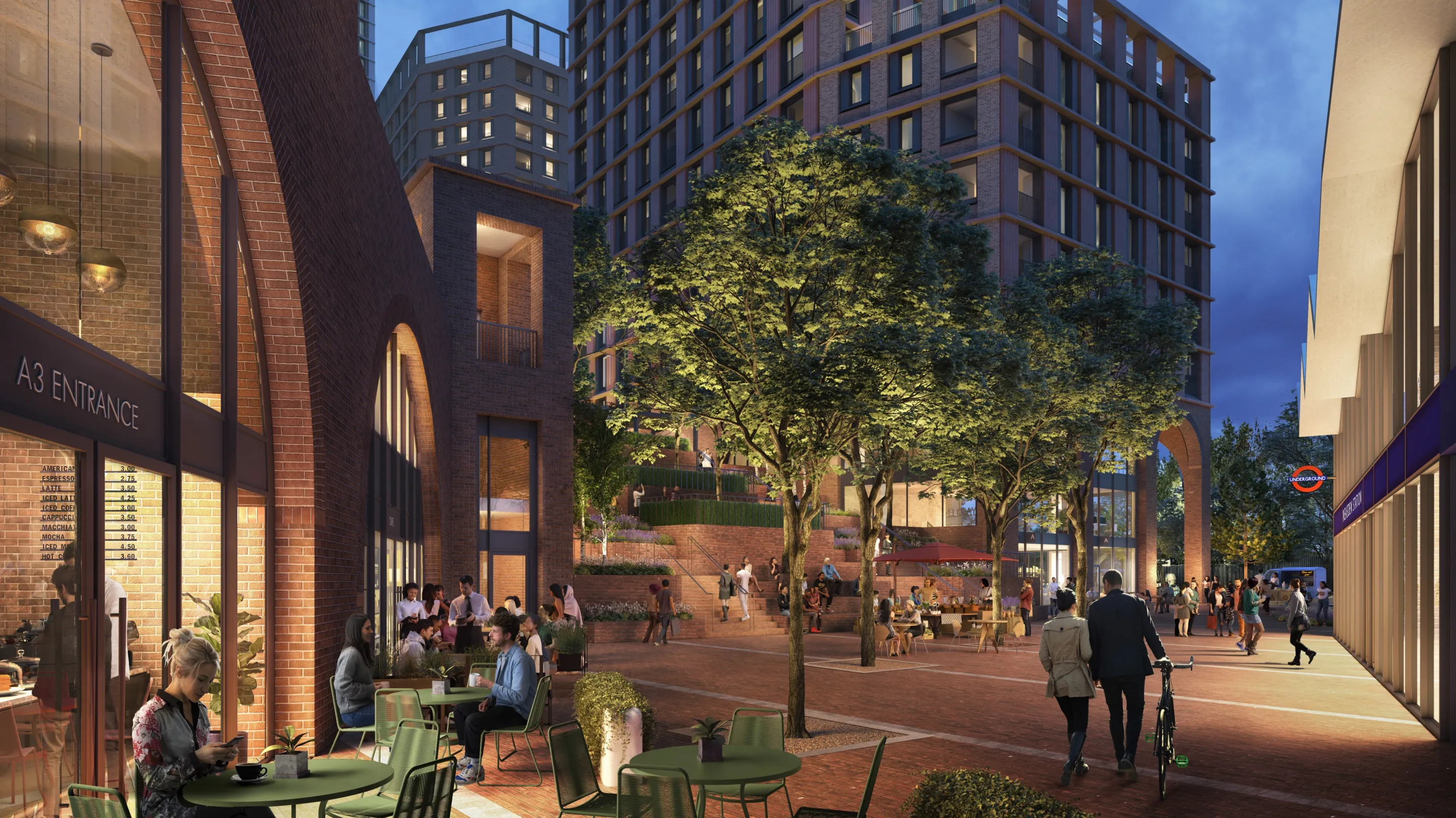 Large residential buildings rises above a central pedestrian plaza with trees and cafes creating a pleasant atmosphere. A london underground station is integrated into the building on the right.