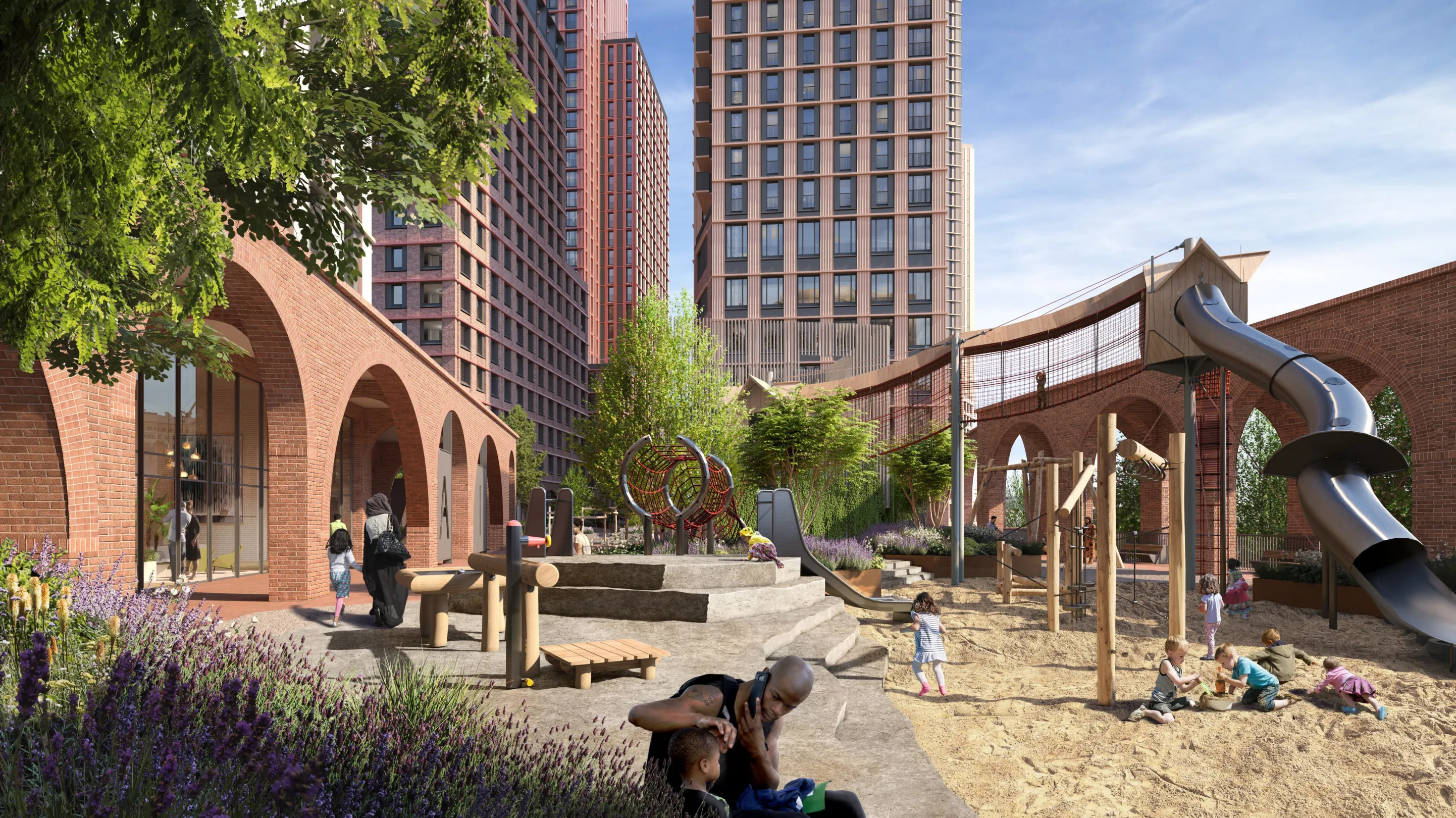 A children's play area with slide and sand pit in front of large modern residential buildings behind and and brick arches with commercial space to the left.