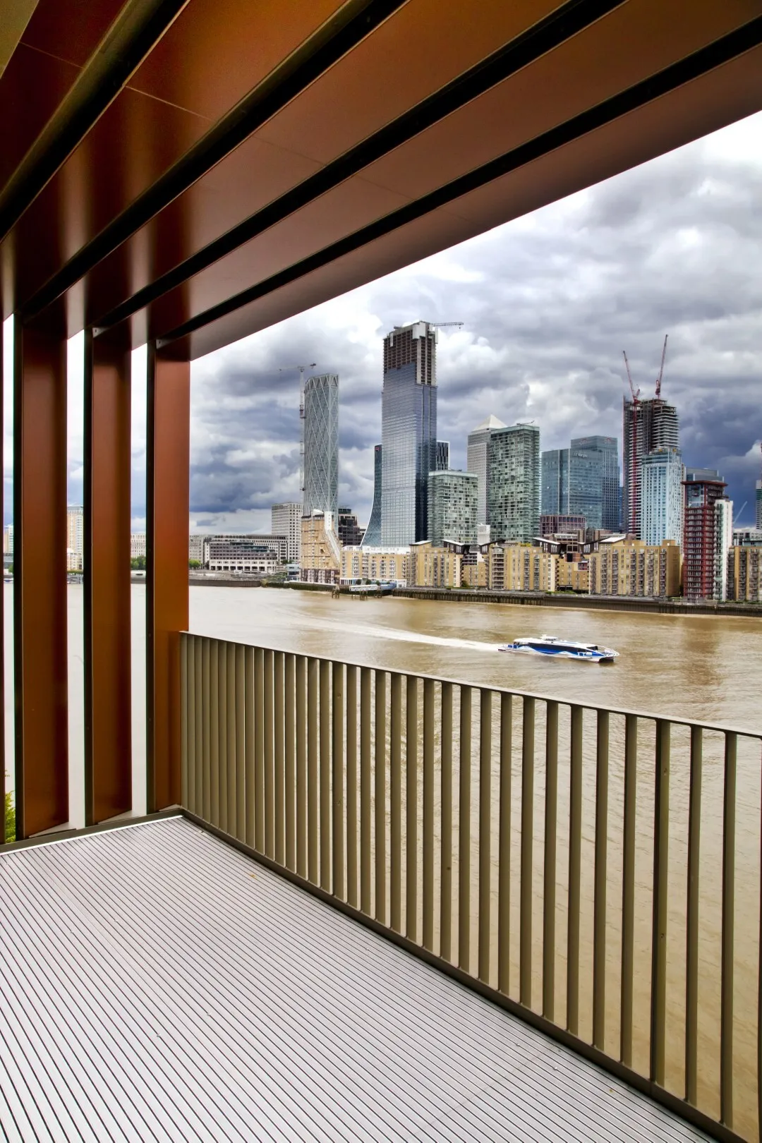 Stunning view from a balcony across the river Thames looking towards Canary Wharf