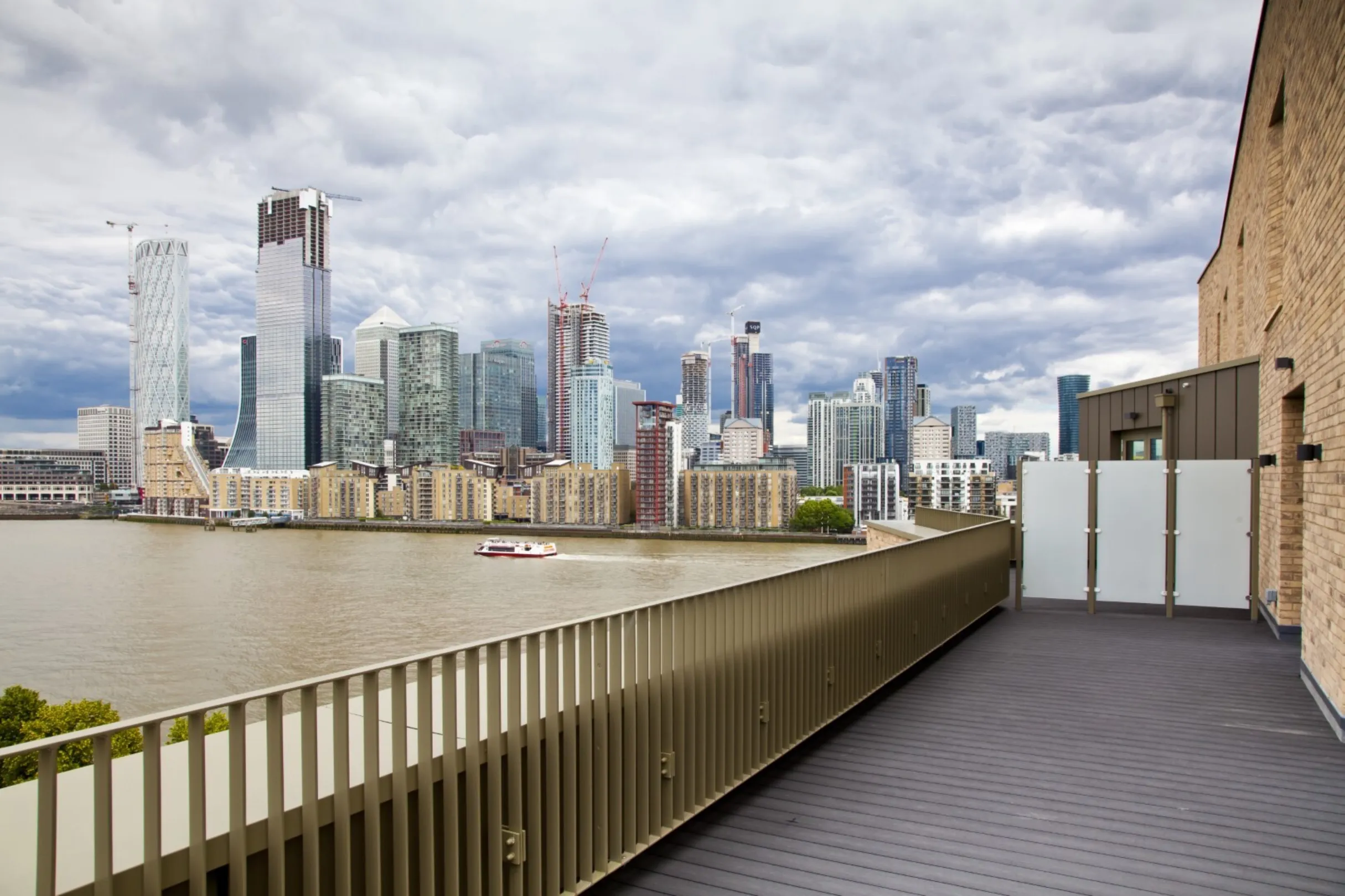 Stunning view from a balcony across the river Thames looking towards Canary Wharf