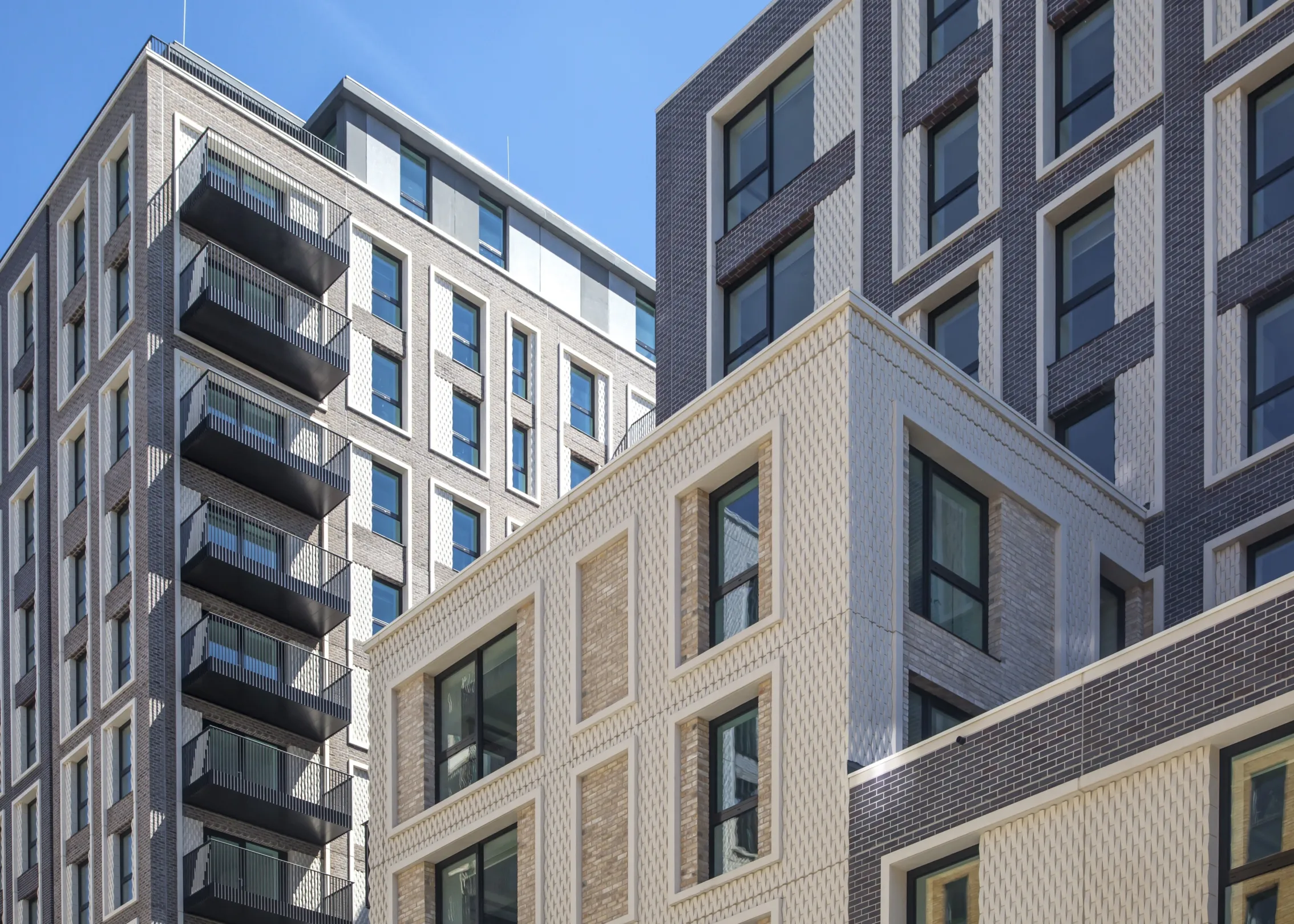 Looking up towards the top of residential buildings