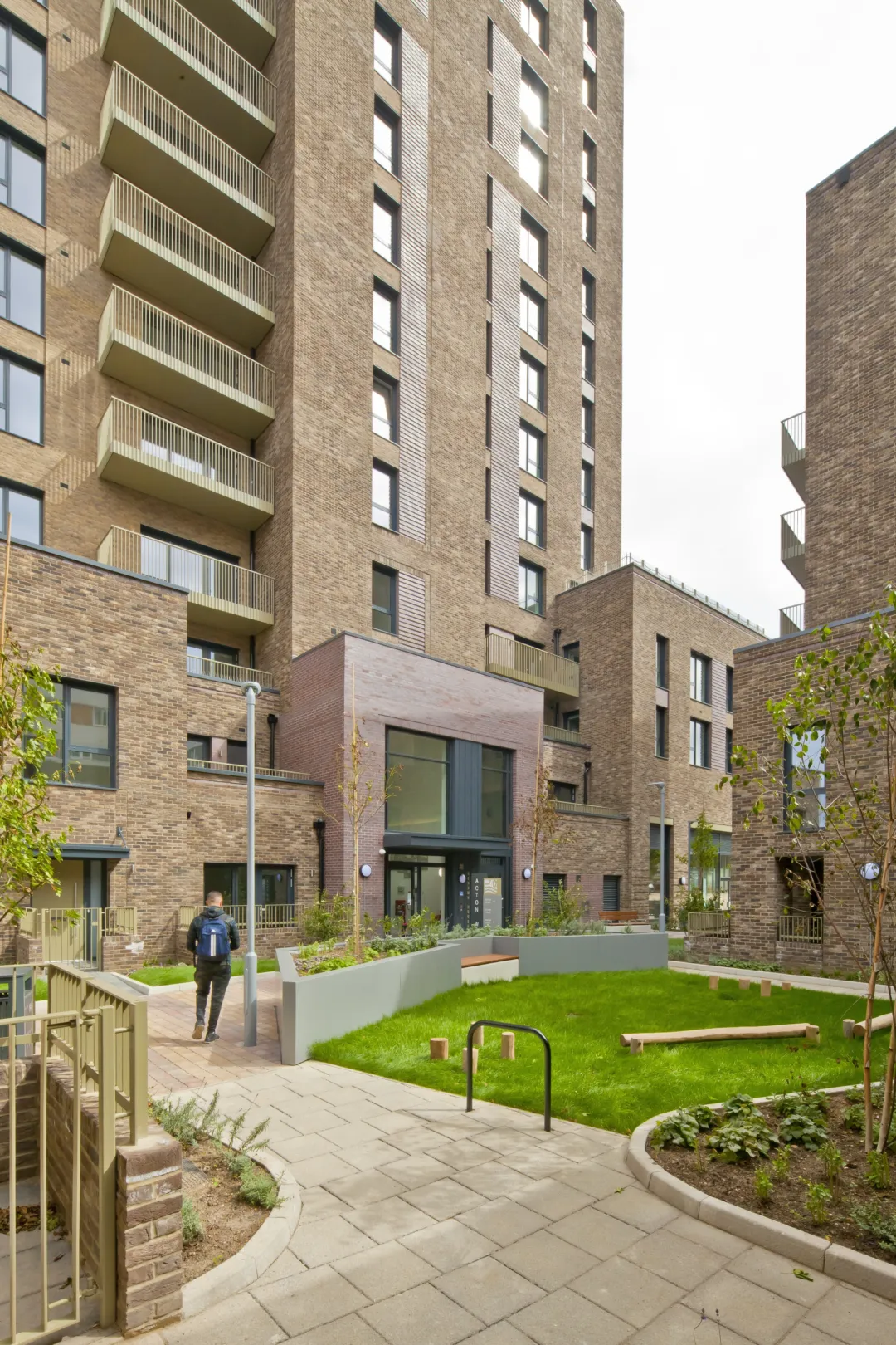 A modern multi storey residential building modernist landscaped gardens