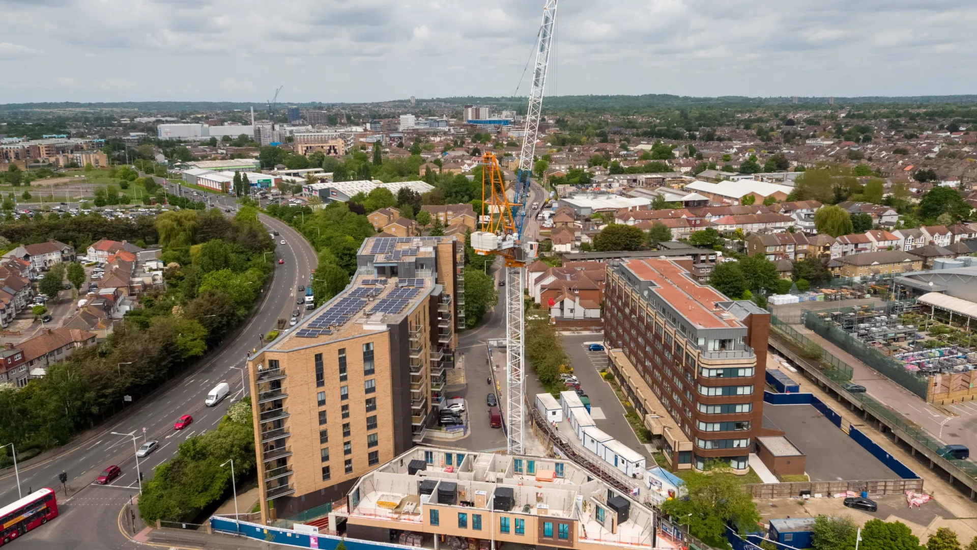 A construction site in Romford, the structural frame being erected with a tower crane overhead